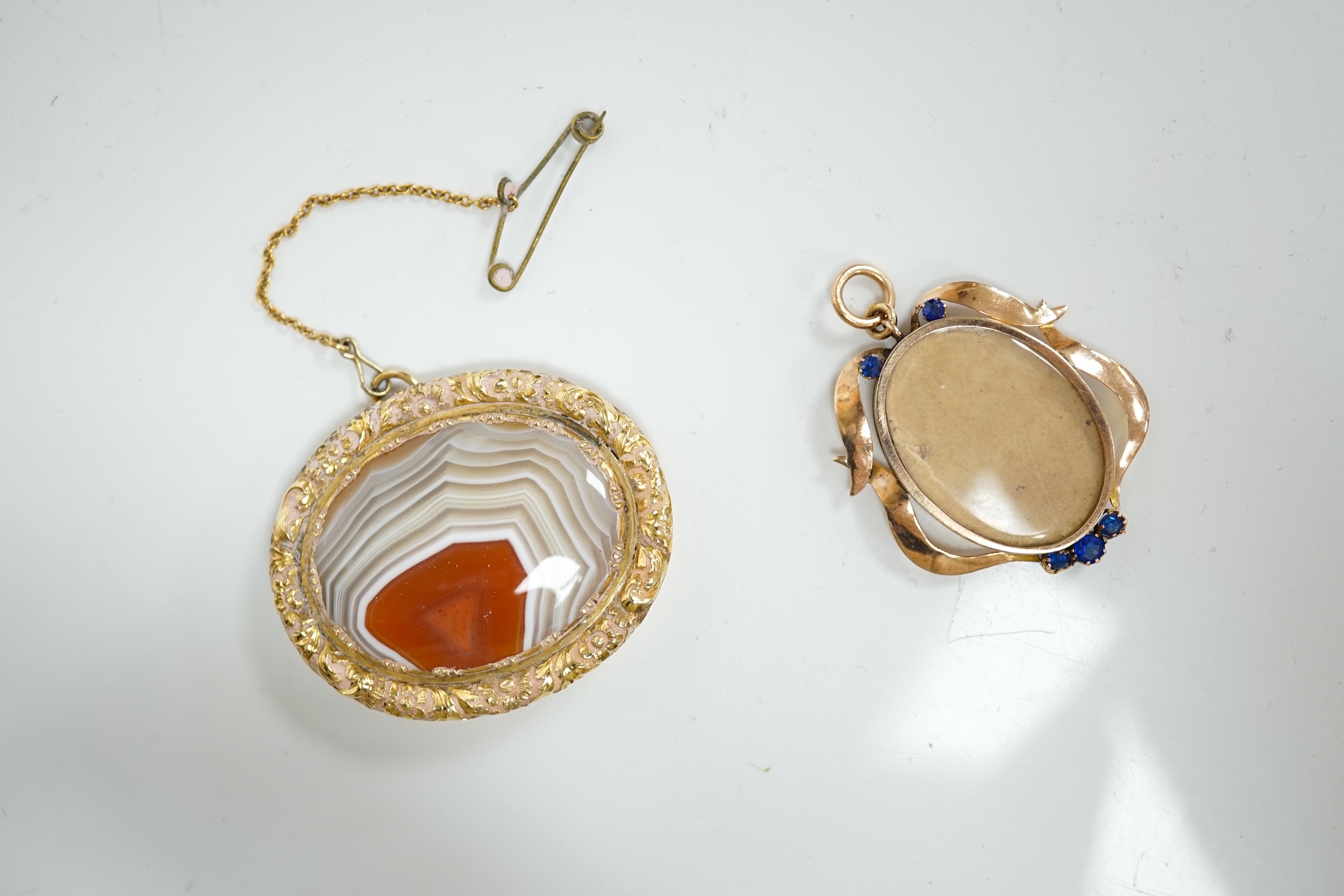 An early 20th century 9ct and gem set oval locket (lacking back?), 32mm, together with a silver mounted golf club hat pin and a mounted agate brooch. Condition - poor to fair